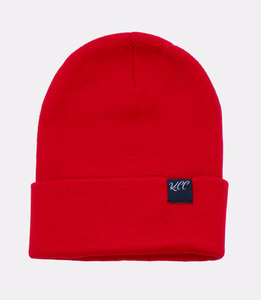 red beanie hat made of breathable acrylic knit that provides warmth and delivers a unisex fit, includes an adjustable cuff